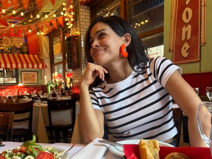 Sofi at a restaurant table in Buenos Aires