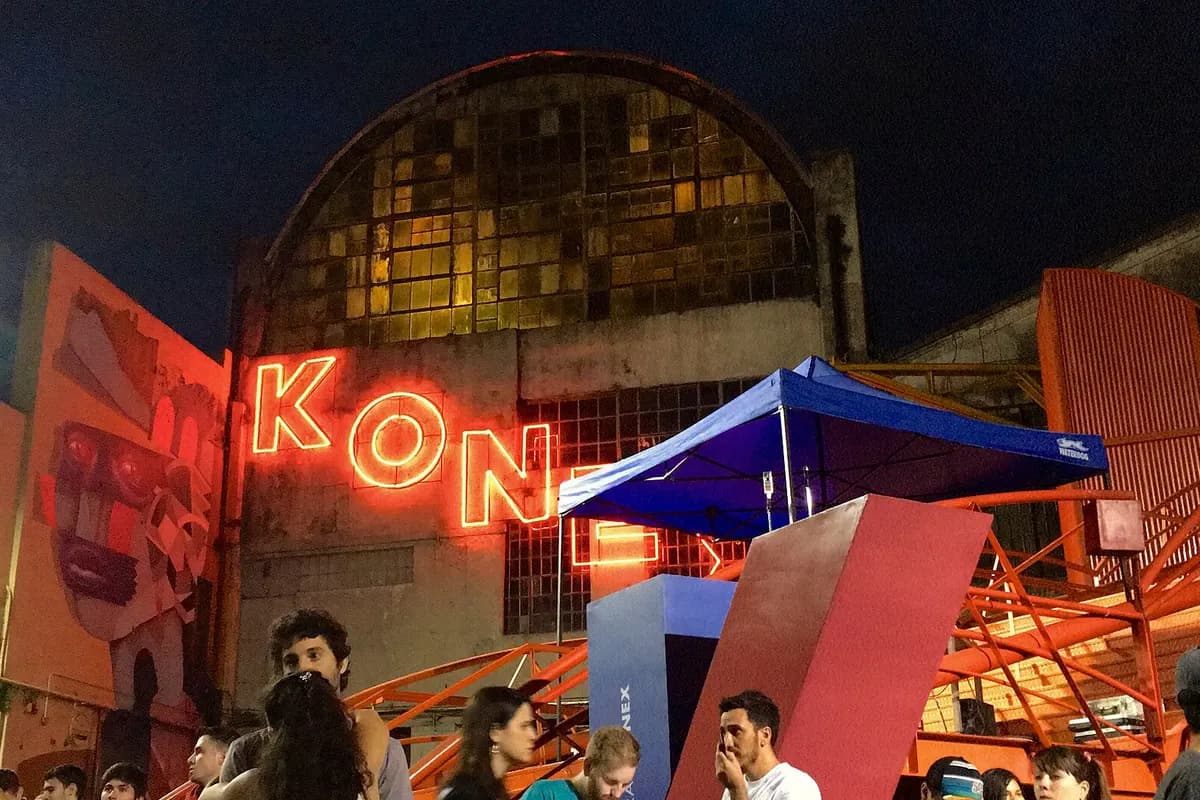 The Konex sign lit up at night over the venue's courtyard
