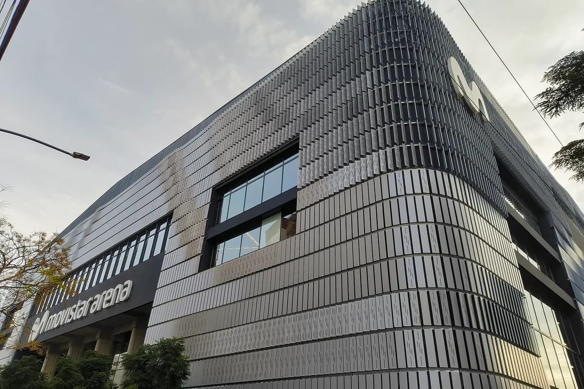 The curved, metal-clad facade of the Movistar Arena in Villa Crespo