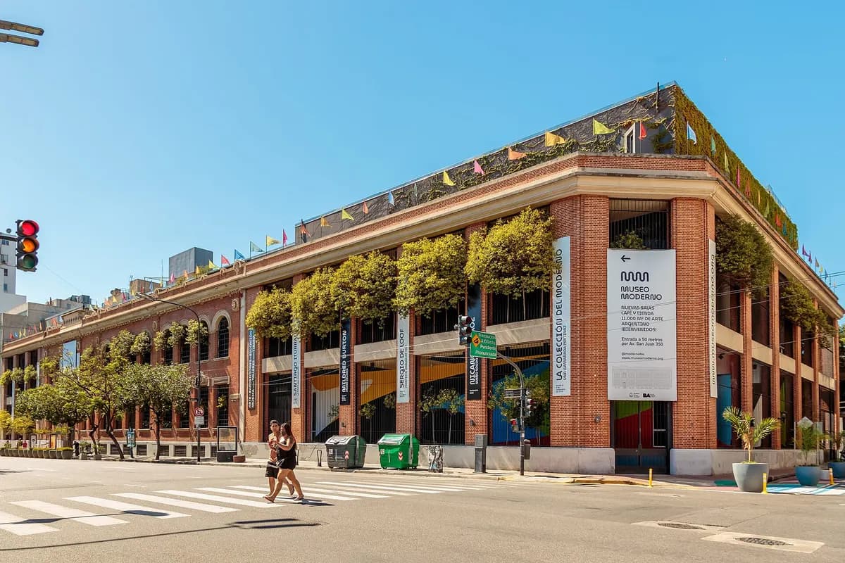 The brick corner building of the Museo Moderno in San Telmo, with plants along its terraces