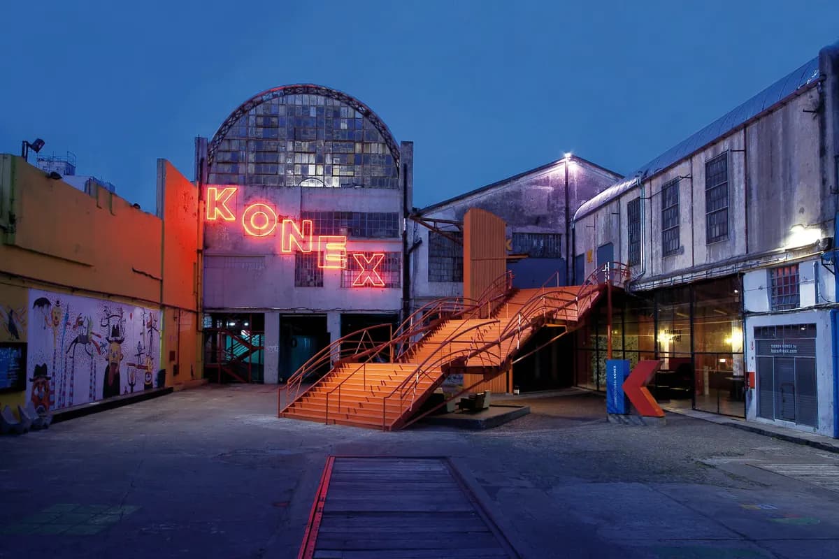 The neon Konex sign and orange stairway of Ciudad Cultural Konex at dusk